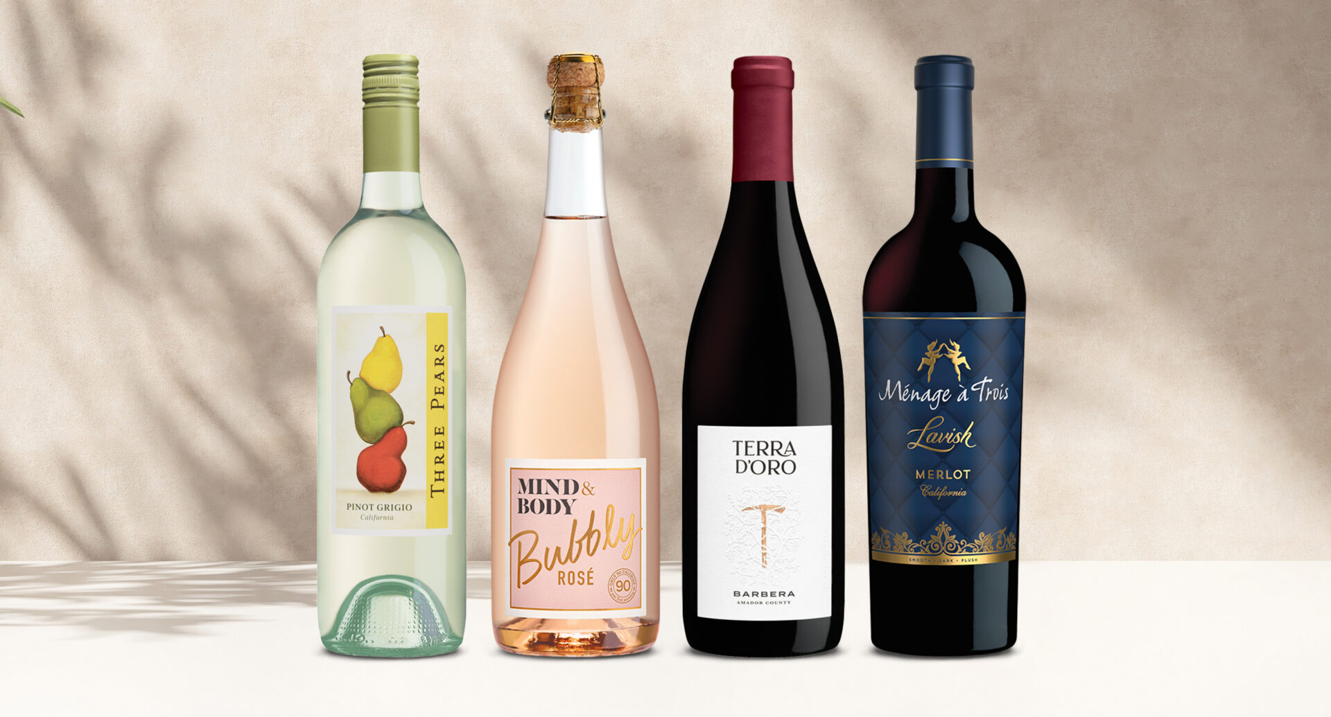 one bottle of three pears pinot grigio, one bottle of mind & body bubbly rose, one bottle of terra d'oro barbera, and one bottle of menage a trois lavish merlot
