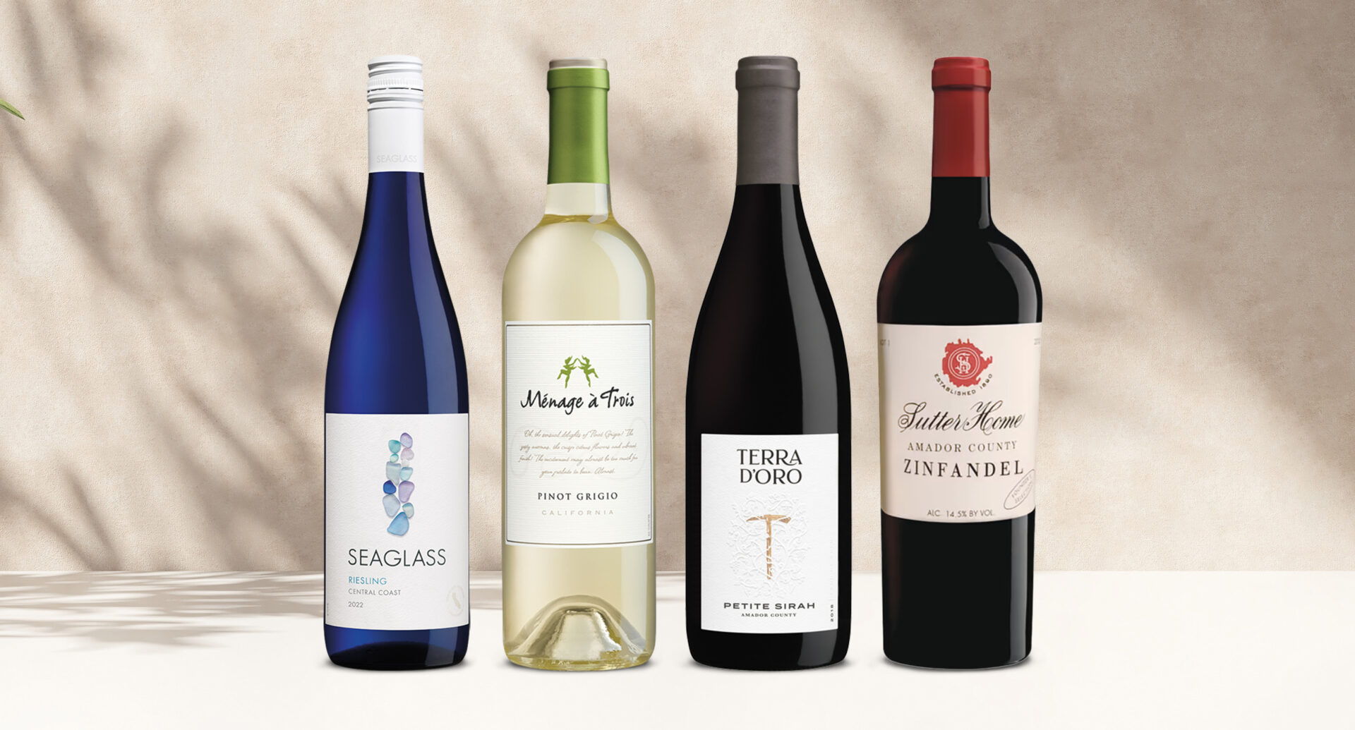 one bottle of seaglass riesling, one bottle of menage a trois pinot grigio, one bottle of terra d'oro petite sirah, and one bottle of sutter home amador county zinfandel