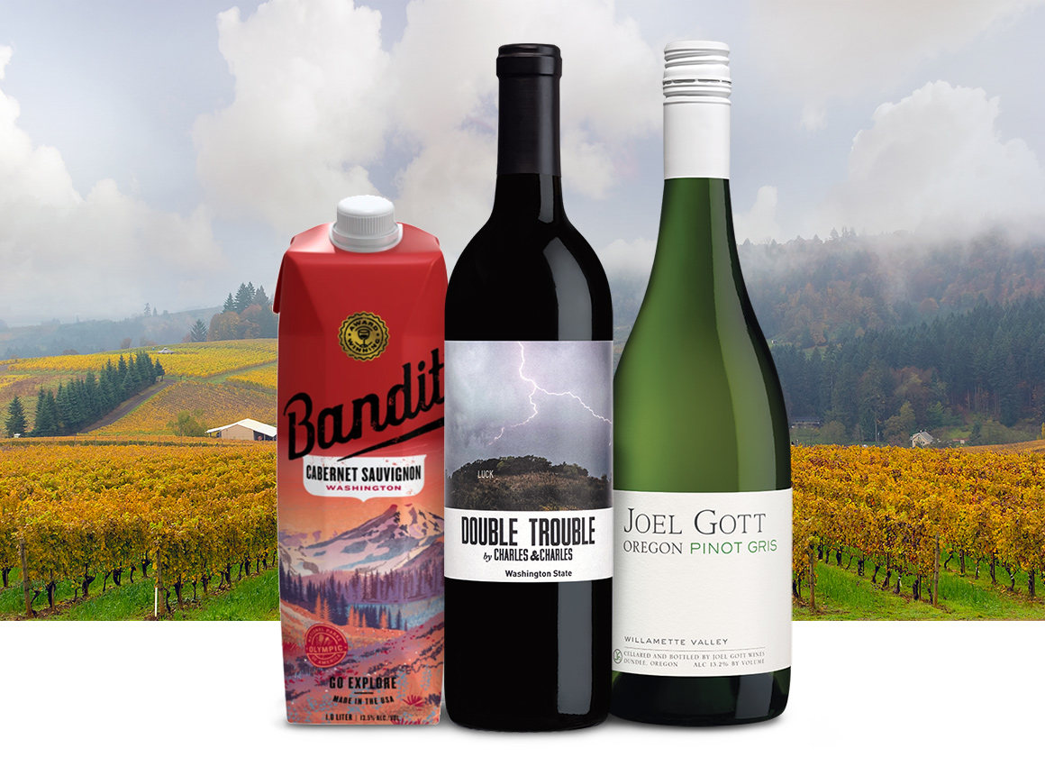 wines from a pacific northwest in front of a misty washington state vineyard