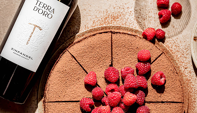 bottle of Terra d'Oro zinfandel next to a red wine chocolate cake